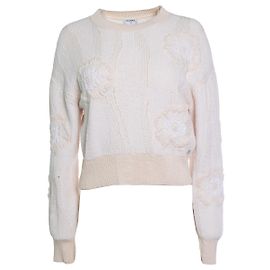 Chanel, jersey de punto con camelia color salmón