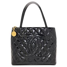 Saco Tote Chanel Reissue com ferragens douradas