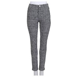 Pantalones cónicos Chanel negros con puños de cremallera Sz.40 de segunda mano