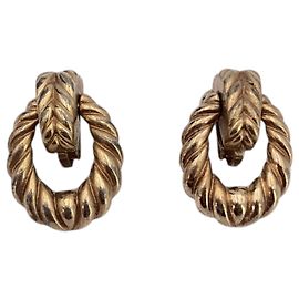 Christian Dior Orecchini a clip a cerchio intrecciato in metallo dorato vintage
