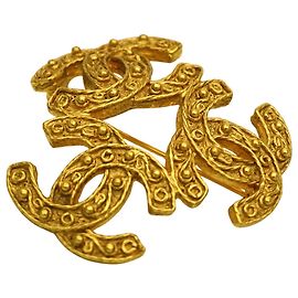 Broche Chanel GP Triple Coco Dourado