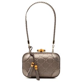 Clutch Gucci Broadway in Guccissima metallizzata viola con chiusura in bambù