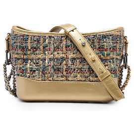 Bolso bandolera Gabrielle Small de tweed dorado y piel de becerro metalizada Chanel