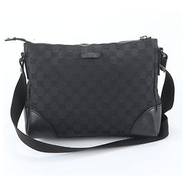 Sac messager Gucci en toile GG et cuir