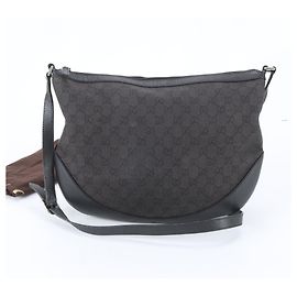 Bolsa de Ombro Gucci em Lona GG e Couro