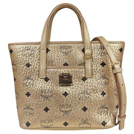 Bolso de hombro MCM de cuero dorado