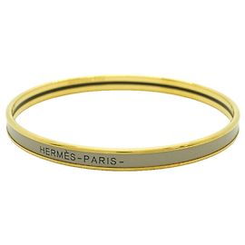 Hermès Bracelete Hermes banhado a ouro bege