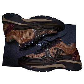 Chanel Sneaker aus Leder und Glitzergewebe in Braun/Gold