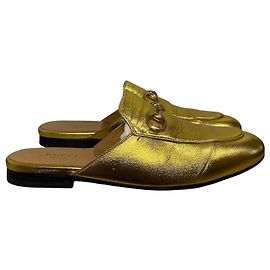 Mules Gucci Princetown dorate T.37