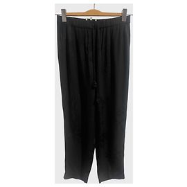 Pantalones Nanushka negros T.S