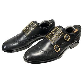 Gucci Mocasines de piel negra con doble hebilla y tachuelas