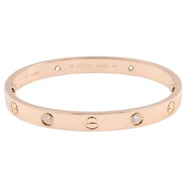Pulsera charm de oro rosa de 18K Cartier con diamantes