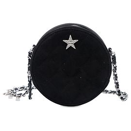 Clutch rotonda Cocostellar in camoscio trapuntato nero Chanel con catena