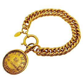 Bracciale con ciondolo a cerchio placcato oro Chanel Cambon