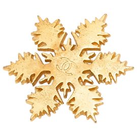 Spilla a fiocco di neve Chanel CC placcata oro