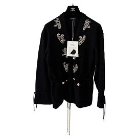 Cardigan Chanel Metiers d'Art in cashmere nero con paillettes ricamate