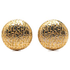 Boucles d'oreilles clips rondes Chanel plaquées or avec logo
