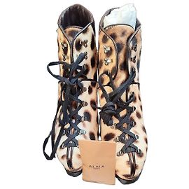 Alaïa wedge boots in calf leather and leopard