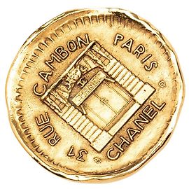 Broche redonda Chanel 31 Rue Cambon banhada a ouro