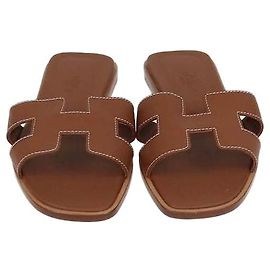 Hermès Sandales Oran en cuir Box calf Gold Hermes