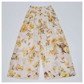 Pantalones de pierna ancha Zimmermann beige de ramio con estampado floral