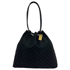 Borsa semi-spalla in pelle e tela GG Canvas Gucci con coulisse