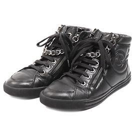 Sneakers alte Chanel in pelle con catena