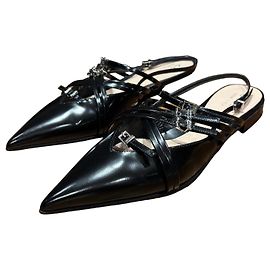 Gucci Mules aus schwarzem Leder mit Riemchen