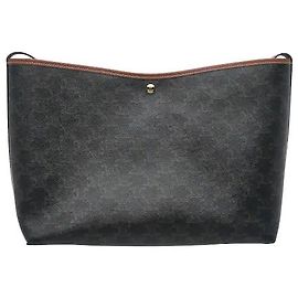 Céline A shopper bag harmonizing Celine's iconic Triomphe canvas with calfskin material. Its flexible, soft silhouette with generous storage space is great for practical everyday use. Inside, a pouch for
