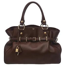 Céline A product adding a naturally flowing silhouette to soft Souple calfskin material. Belt detailing wrapping the front of the bag, a gold-tone logo, and a detachable padlock charm add a classic yet