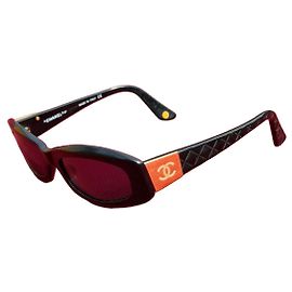 Chanel Black Sunglasses with Orange CC Logo