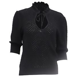 Blusa de punto con volantes Ganni en lino negro