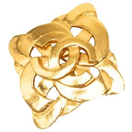 Broche torsadée Chanel CC plaquée or doré