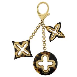 Charm per borsa Louis Vuitton Insolence in metallo e tartaruga