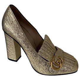 Gucci GG Fringe Pumps aus goldfarbenem Leder