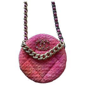 Bolso redondo Chanel en tweed rosa y naranja