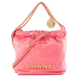 CHANEL - Chanel 22 mini Schultertasche aus glattem rosa Leder