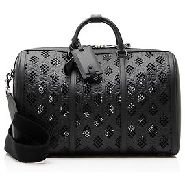 Sac Duffle Medium en cuir embossé GG perforé Gucci