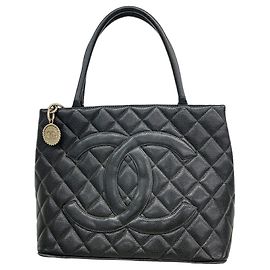 Borsa Tote Chanel in pelle di vitello martellata nera