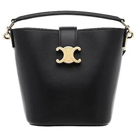 Céline A flexible bucket silhouette harmonizes with sensuous leather for a sophisticated mood. The house's iconic Triomphe logo ornament serves as an elegant point, and generous interior storage capacity