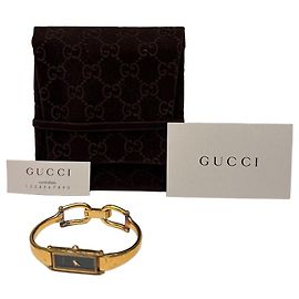 Vintage Gucci Armbanduhr goldfarben schwarzes Zifferblatt späte 1980er