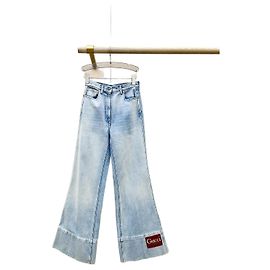 Calças jeans flare Gucci em denim azul
