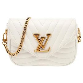 Louis Vuitton Eine Crossbody-Tasche von unvergleichlicher Raffinesse mit einer flexiblen Wellensteppung aus weichem Kalbsleder. Eine modulare Struktur, die eine abnehmbare Kette, einen Schulterriemen und einen runden Geldbeutel kombiniert.