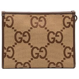Pouch Gucci in tela Jumbo GG marrone