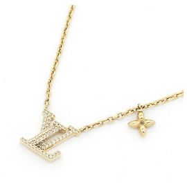 Collana con pendente Louis Vuitton in metallo dorato e strass