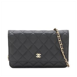 Chanel WOC in pelle Caviar matelassé con patta Crossbody Black