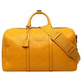 Borsa Duffle Gucci in pelle di vitello goffrata GG gialla