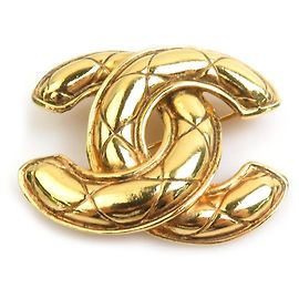 Spilla in metallo dorato Chanel