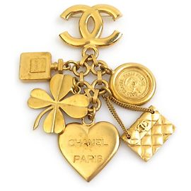 Spilla in metallo dorato Chanel