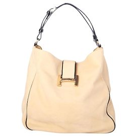 Autre Marque Bolso Hobo Hogan de piel beige con ribetes de charol negro